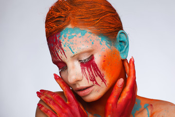 Portrait of a model in an expressive creative style using an unusual make-up