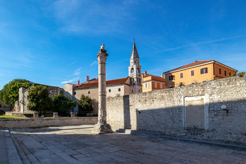Roman Pillar of Shame and St Elias`s Orthodox Church, in Zadar Old Town, Croatia