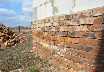 Bad brick house foundation wall