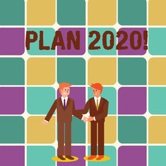 Text sign showing Plan 2020. Business photo showcasing detailed proposal for doing or achieving something next year Two Businessmen Standing, Smiling and Greeting each other by Handshaking