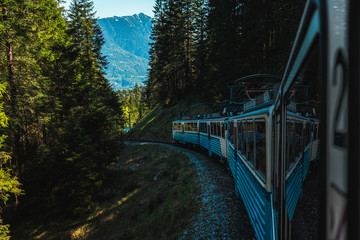 View out of the window of Bavarian Zugspitz Railway / Zugspitzbahn on its ascent towars Zugspitze, Germanys highest mountain, during summer (Grainau, Germany, Europe)