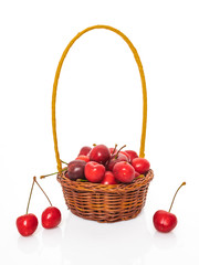 Cherry in basket isolated on white background