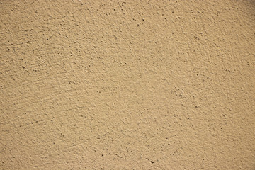 Beige painted grunge wall rough texture