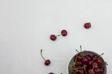 big cherry in a plate on a white background
