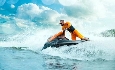 Fotobehang Young Man on water scooter, Tropical Ocean, Vacation Concept. Jet Ski. Sea. © VIAR PRO studio