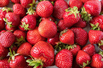 Background of fresh strawberries. Ripe strawberries. Ripe berries close-up. Various fresh summer berries. Background of red berries.