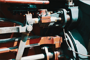 Black hydraulic brake cylinder of a historic locomotive