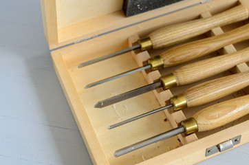 Set of carpenter tools in box on the table