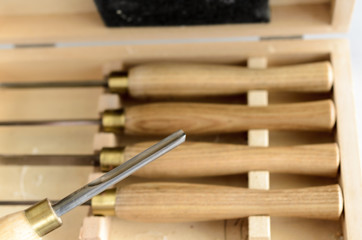 Set of carpenter tools in box on the table