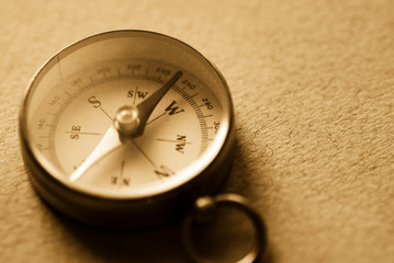 Sepia toned image of a magnetic compass