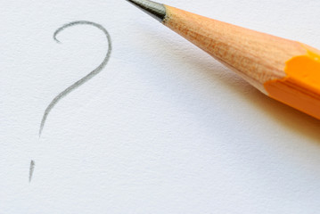 Pencil and written question mark