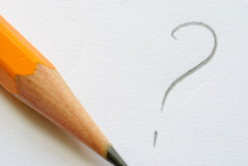 Pencil and written question mark