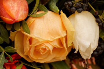 Macro on frozen yellow and white roses. Beautiful Funeral arrangement.