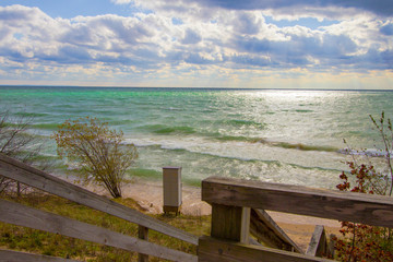 Fototapeta na wymiar Lake Michigan Beach. Beautiful beach on the coast of Lake Michigan on a sunny beach in the Upper Peninsula of Michigan.