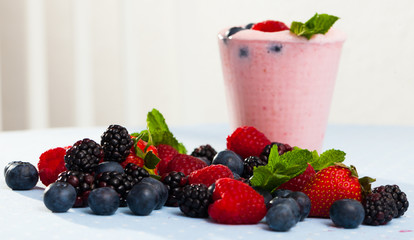 Tasty berry milk smoothie closeup