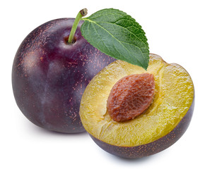 Plums half with leaves isolated