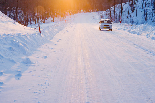 Car on Snow Covered Road