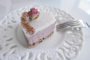 Eating Vegan Fruit Cake with a Rose Decoration