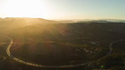 HILS AND ROCKS ON SUNSET  AERIAL VIEW 