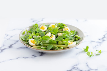 salad with quail eggs and asparagus for summer menu