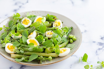 salad with quail eggs and asparagus for summer menu