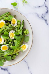 salad with quail eggs and asparagus for summer menu