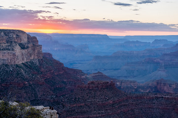The setting sun sinking below the horizon of the Grand Canyon, near Yavapai point on the southern canyon rim.