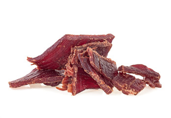 Portion of beef jerky on a white white background. Full depth of field.