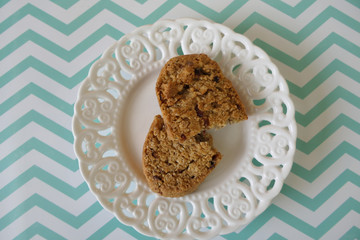 Cookies in a White Vintage Plate on Zigzag Background