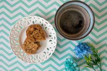 Cookies in a Plate with Caffee on a White and Green Zigzag Background