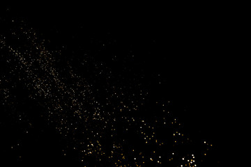 Fototapeta premium Golden abstract bokeh on black background. Holiday concept