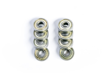 Eight bearing isolated on white background in two rows with steel tubes
