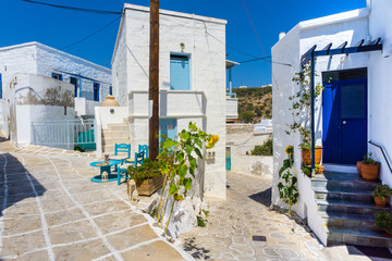 Fototapeta na wymiar Street view of Chorio with paved alleys and traditional cycladic architecture in Kimolos island in Cyclades, Greece