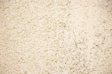 Beige painted grunge wall rough texture