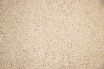 Beige painted grunge wall rough texture