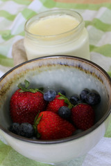Homemade Yoghurt with Fresh Strawberries and Blueberries on a Wooden Background