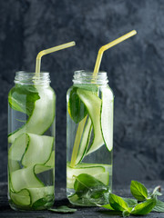 Cucumber detox water with mint in two glass jars