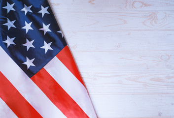 Fototapeta na wymiar Flag of United States of America on white wooden background. 4th of july, independence concept.jpg