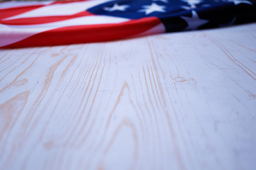Naklejka premium Flag of United States of America on background with white wooden texture. 4th of july, independence day concept.jpg