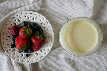 Homemade Yoghurt with Fresh Strawberries and Blueberries on a Wooden Background