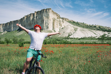 Recreation and holidays. Funny man riding a bike.