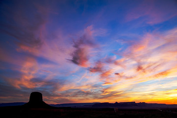 A beautiful sky with a lone butte in Monument