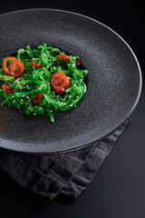 Chuk salad on a black plate