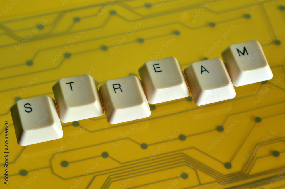 Poster keyboard keys form the word stream on yellow electric circuit in the background.