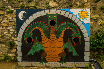 Bratislava,Slovakia: Tantamareski depicting the three-headed fairy dragon, a photo stand for a...