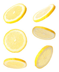Set of cut fresh juicy lemon on white background