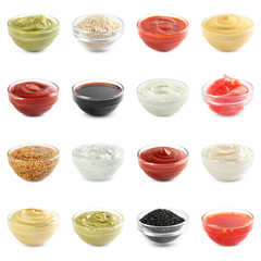 Set of different delicious sauces on white background