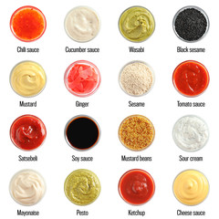 Set of different delicious sauces on white background, top view