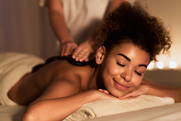 Obraz na płótnie Canvas Body Treatment. Relaxed Girl Enjoying Hot Massage