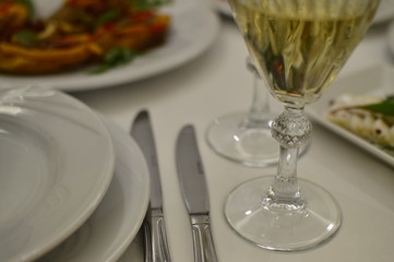 Diner table server with wine glasses and food